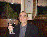 Peter Molyneux with glass of wine